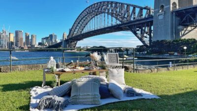 Luxury Picnic for 2 with Sydney Harbour Views at Kirribilli - The full picnic setup: flowers, cloth, cushions, and the stuff you don’t have to carry