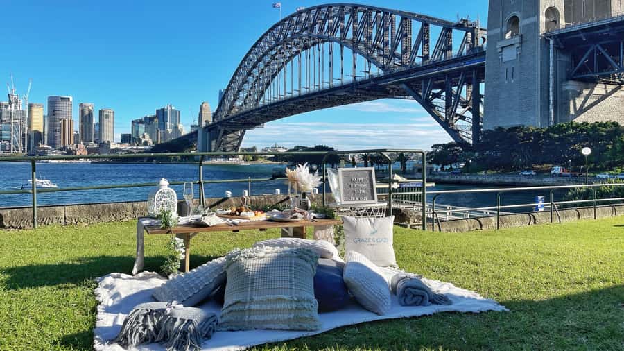 Luxury Picnic for 2 with Sydney Harbour Views at Kirribilli - The full picnic setup: flowers, cloth, cushions, and the stuff you don’t have to carry