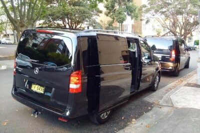 Private Transfer FROM Sydney Airport to Sydney CBD 1 to 5 people - The ride: minivan comfort, tinted windows, and luggage capacity