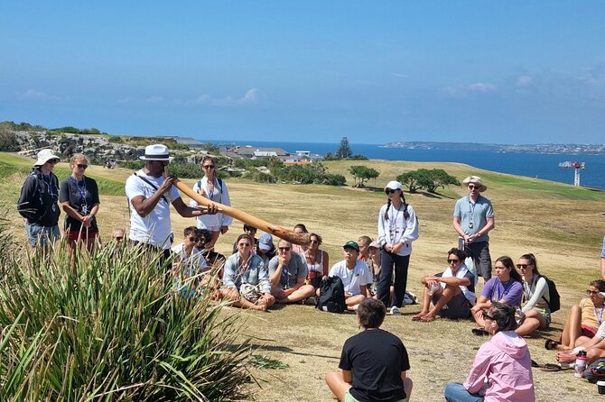 Private Walangari's Aboriginal Walking Tour in Bondi Beach - Stop 1 at Bondi Beach: carvings, bush foods, and coastal time travel